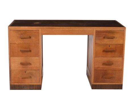 An Art Deco oak pedestal desk, circa 1930, possibly by Gane of Bristol, 78cm high, 61cm deep, 137cm wide Provenance: The esta