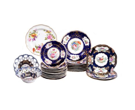 The remnants of a Derby (Rbt. Bloor) dinner service, circa 1825, painted with panels of flowers reserved on a blue and gilt g