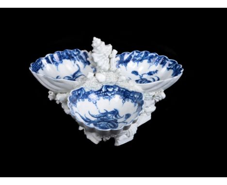 A Worcester blue and white triple-shell sweetmeat stand, circa 1765-70, painted with the so-called 'Sweetmeat Stand Rose' pat