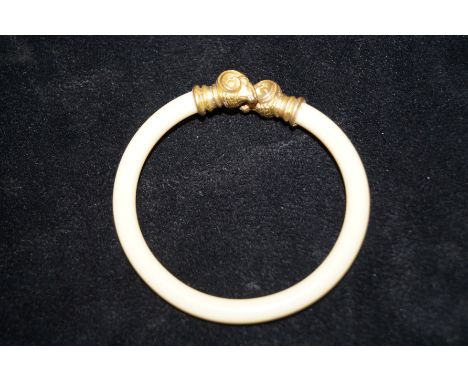 Ivory bangle with rams head terminals