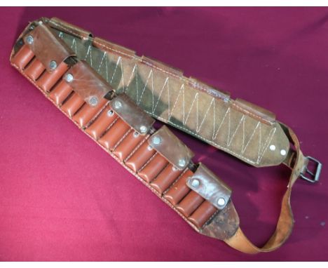 Brown leather shotgun cartridge belt with thirty cartridge loops and pressed button coverings 