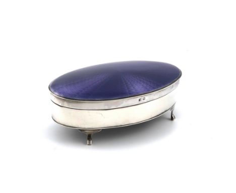 A silver and enamel dressing table box, by the Adie Brothers, Birmingham 1927, oval form, the hinged cover with purple enamel