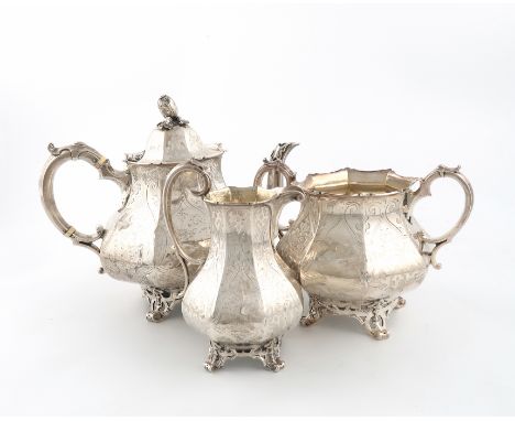 λA three-piece Victorian silver tea set, by The Barnards, London 1853/54, panelled baluster form, engraved decoration, scroll