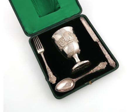 A four-piece cased Victorian silver christening set, by George Adams, London 1863 and 1864, comprising: a cup of circular for