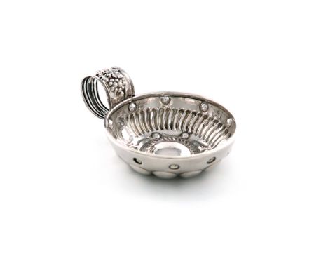 A French silver wine taster, circular form, fluted ring handle with a grapevine, the bowl with fluted and punch bead decorati