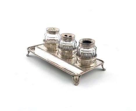 A George III silver inkstand, by William Plummer, London 1785, rectangular form, beaded borders with a pen well, and with thr