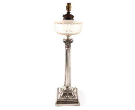 An Edwardian silver oil lamp, by Hawksworth, Eyre and Co., Sheffield 1901, Corinthian column form, with a cut-glass reservoir