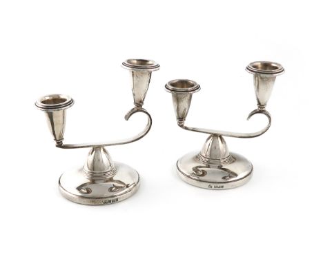 A pair of modern silver two branched candelabra, by Elkington &amp; Co Ltd., Birmingham 1967, squat shaped from, asymmetrical