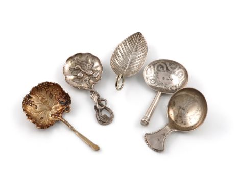 A collection of five antique silver caddy spoons, by various makers and dates, comprising: a Victorian silver-gilt caddy spoo