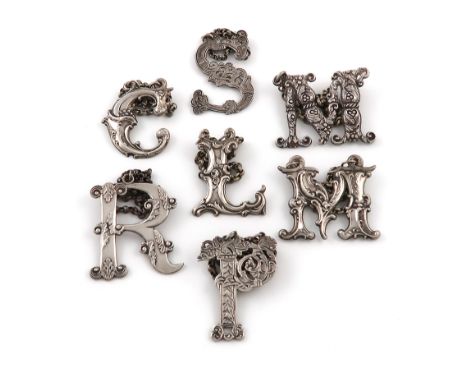 A collection of seven 19th century silver 'Cut-out letter' wine labels, comprising a set of three Scottish ones, by James How