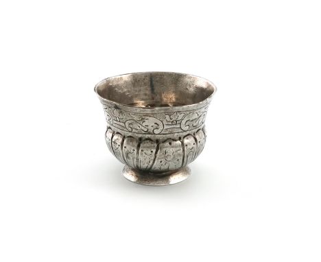 An 18th century Russian silver vodka cup, maker's mark worn, Moscow circa 1735, circular bellied form, part fluted with folia