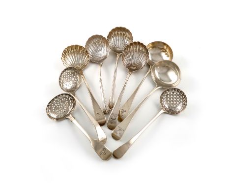 A collection of nine antique silver sugar sifting spoons and ladles, various dates and makers, comprising: two of Onslow patt