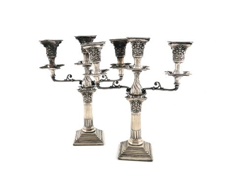 A pair of Edwardian silver candelabra, by Walter Latham &amp; Son, Sheffield 1905, Corinthian column form, on a stepped squar