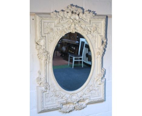 A classical designed mirror, of inverted rectangular form, raised with moulded flower heads, leaves and entwined branches, su