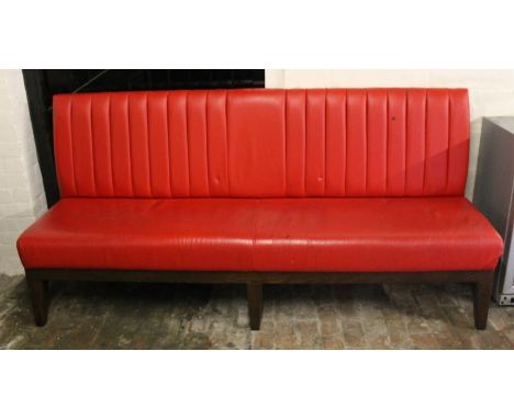 A beech framed bench, with red leather seats.