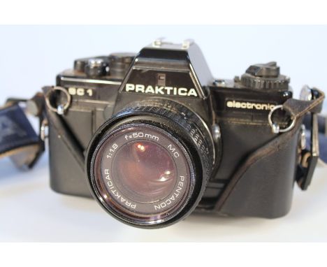 A quantity of cameras and equipment, to include Praktica BC1 with 1:1.8 lens, various other lenses Sigma, etc, and a material