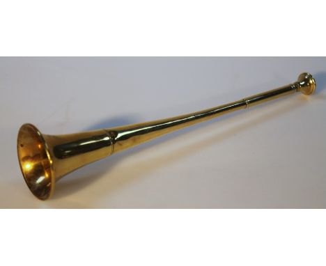 An early 20thC brass hunting horn, of cylindrical form with a circular mouth piece and horn shaped end, 32cm high.