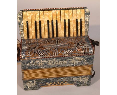 A mid-20thC German Pietro piano accordion, in a marble case with mother of pearl finish keys and leather fittings, 43cm wide.