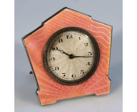 A French Art Deco pink enamel and chrome travelling clock, the angular case centred by a circular 5cm dial with a textured si