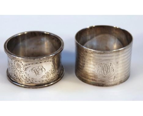 A Victorian silver napkin ring, of circular engine turned form, London 1860, makers mark rubbed and another silver napkin rin