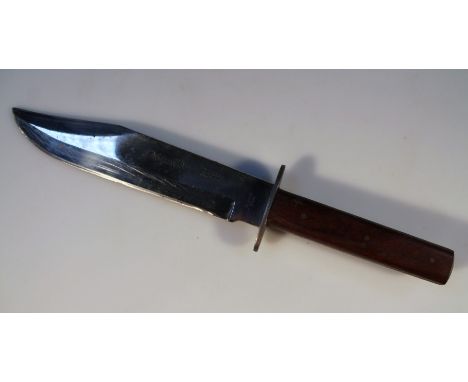 A Sussex Army Bowie knife, with plain part named blade and a polished wooden handle, with leather scabbard, probably third qu