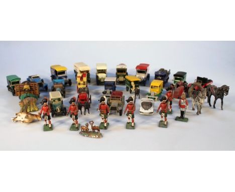 A quantity of Britains lead soldiers and various die-cast vehicles, to include Scottish Regiment Bandsman, two horses, and a 