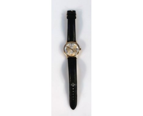 An Omega Seamaster De Ville gentleman's wrist watch, the shaped face of circular form with a gold coloured back, with baton p
