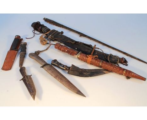 A small quantity of various edge weapons, to include a Turkish style Kailij curved dagger, another in a heavily carved scabba