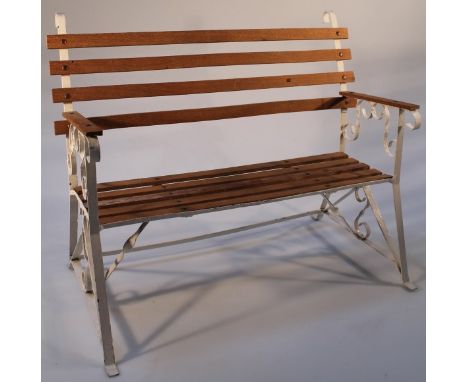 A 20thC miniature beech and metal framed dolls bench, of slatted form on a shaped scroll base, painted white, 43cm high.