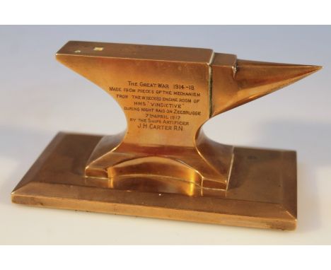 A brass paperweight in the form of an anvil, of typical form, engraved to the body The Great War 1914-1918, made from pieces 