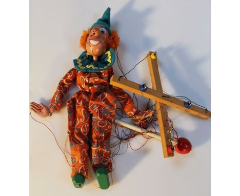 A 20thC Pelham puppet, of a clown in a Clever Willie box, 30cm high.