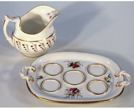 A 19thC Chamberlain Worcester egg stand, of oval form with a gilt outline and gilt highlighted strap work handles, partially 