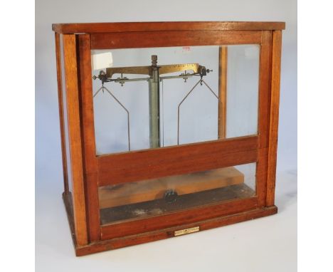 A set J Preston Limited scientific scales, each with chrome dishes and mounts, with a metal centre on a wooden platform base 