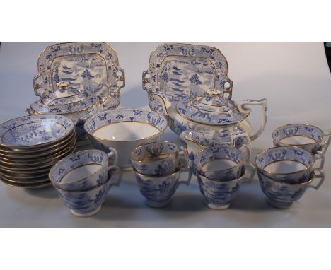 An early 19thC blue and white transfer printed part tea service, comprising lidded sucrier, teapot, stand, serving plates, sl