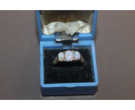 A BOXED GOLD THREE STONE OPAL RING A/F