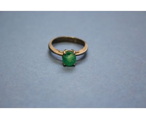 An unmarked ring set oval Columbian emerald; together with a loose oval ruby gem stone, 15mm x 11mm, weight 2.1g.