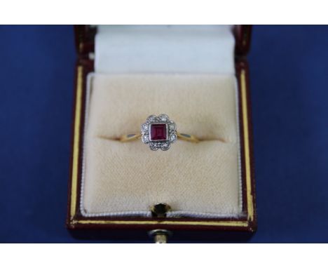 An Edwardian 18ct gold and platinum ruby and diamond ring. Condition Report: All stones present, shank worn. Size T.   2g tot