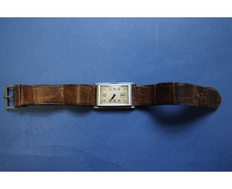 A vintage Swiss movement tank wristwatch, on leather strap; and a small amount of unmarked gold, 1.3g. Condition Report: Wind