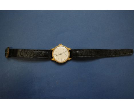 A vintage Longines 18ct gold gentleman's mechanical wristwatch, on replacement leather strap. Condition Report: Winds and tic