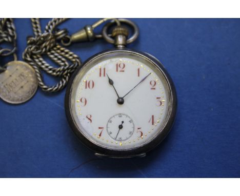 A Continental .935 silver fob watch; together with two cased Queen Elizabeth II £5 coins.