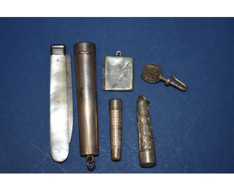 A silver cheroot holder case; together with a silver cigarette holder case; a silver stamp holder; a silver bladed fruit knif