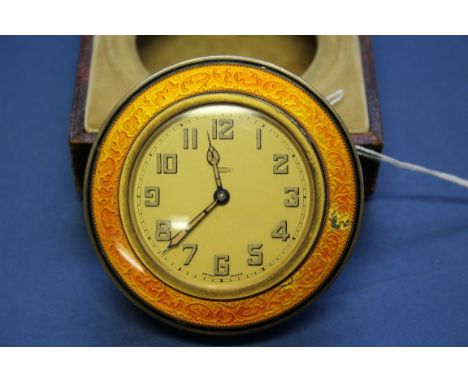 An Art Deco orange enamel eight day easel clock, in fitted Mappin & Webb case. Condition Report: In working orderEnamel damag