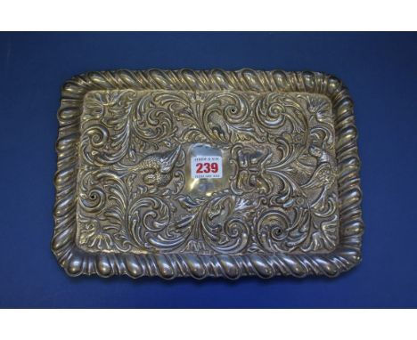 A silver rectangular dressing table tray, by W B Ltd, Birmingham,1911, having rococo decoration, 30cm, 236g.
