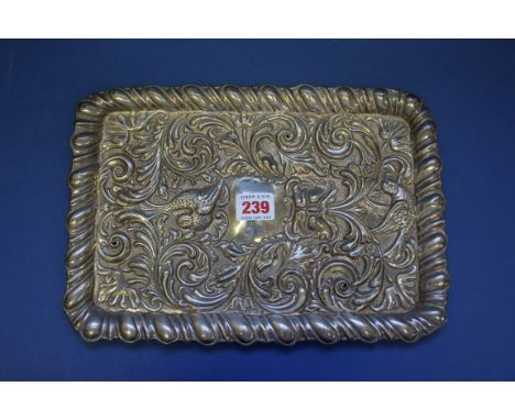 A silver rectangular dressing table tray, by W B Ltd, Birmingham,1911, having rococo decoration, 30cm, 236g.