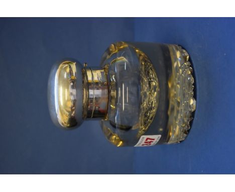 An Edwardian oversized glass inkwell, London 1904, having hinged silver lid and hobnail cut base, 14cm. Condition Report: Mul