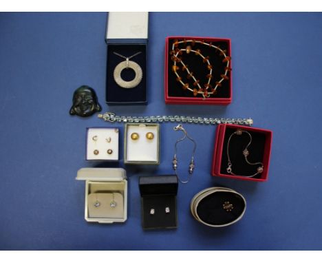 A selection of silver and 9ct gold jewellery; to include two pairs of 9ct ear studs; two boxed Pia silver bracelets; and a bo