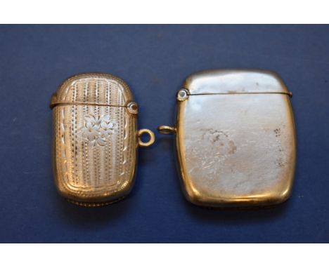 A silver engine turned vesta case; together with another example, 33g.