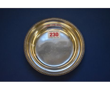 A silver circular dish, by Martin Hall & Co Ltd, Sheffield 1916, having egg and dart rim, 14cm, 103g.