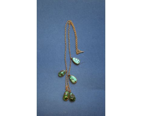 An Edwardian 9ct gold fine chain interspersed with five turquoise peardrops.