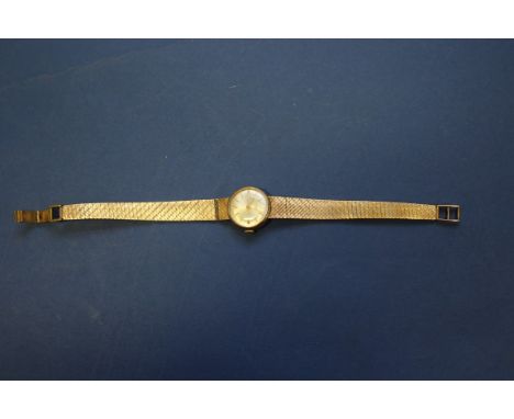 A vintage Tudor Royal 9ct gold ladies mechanical wristwatch, on a 9ct gold mesh bracelet. Condition Report: Winds NOT ticking